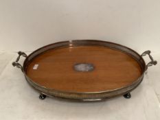 A large oval galleried 2 handled Edwardian tray, on 4 silver plate bun feet