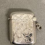 Sterling silver vesta case with chased decoration and vacant cartouche by Percy Fredrick Jackson,