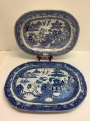 Two large blue and white willow pattern meat platters, the larger 52 x 38 cm, small chip to corner