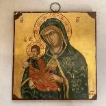 A rectangular religious panel, with a decorative bright gilded style image of Madonna, some wear