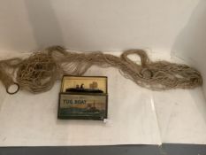 Vintage Tugboat toy in its original box, and a sailors old string hammock
