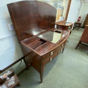 A Sheraton revival inlaid mahogany bow front dressing table, with a fitted compartmented interior,