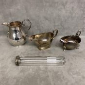 Collection of sterling silver items to include a cream jug, 2 sauce boats, and glass silver topped