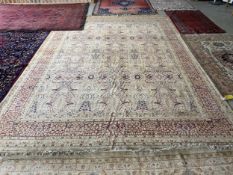Indian Rug, oatmeal ground, with a fine all over repeat pattern, in soft burgundy, 366cm x 271cm The