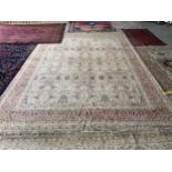 Indian Rug, oatmeal ground, with a fine all over repeat pattern, in soft burgundy, 366cm x 271cm The