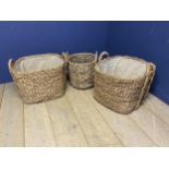 Pair of lined wicker log baskets and wicker basket, in used condition