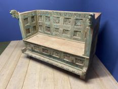 A Decorative carved and painted rustic wooden bench, with horse head carved finials to each side,