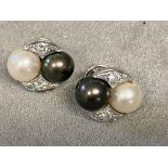 Pair of 18ct white gold and platinum Tahitian white and black pearl ear studs, with diamond accents,