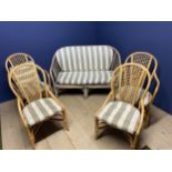 Set of 4 cane arm chairs, and a similar painted two seater settee 130x68x87 cm all with loose