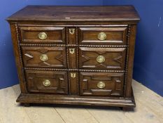 Jacobean style cupboard, the front styled with dummy moulded drawers, these cupboard doors,