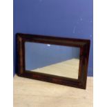 Large mahogany oblong cushion framed wall mirror, some wear to frame