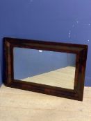 Large mahogany oblong cushion framed wall mirror, some wear to frame