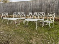 A good painted metal garden furniture set of 2 benches, 2 arm chairs and 2 tables, in used