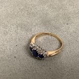 Three stone Sapphire and diamond ring in a 9ct yellow and white metal setting, size I