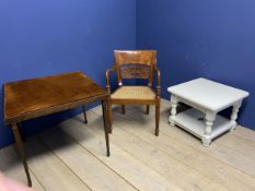 A Bergère seated arm chair on reeded legs and fan designed back splat (in good condition), a white