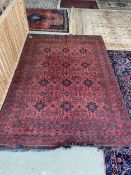 Light burgundy ground Persian Rug, 100% wool , hand knotted with 12 blue lozenges set in a