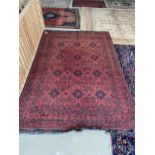 Light burgundy ground Persian Rug, 100% wool , hand knotted with 12 blue lozenges set in a