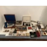 An assortment of costume jewellery, silver, opera glasses, pens and accessories