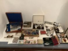 An assortment of costume jewellery, silver, opera glasses, pens and accessories