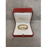 CARTIER: A Ladies 18k solid gold Cartier Paris Tank Bracelet Watch circa 1980s. 671172171.