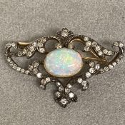 Edwardian opal & diamond brooch central oval cabochon cut opal 10mm x 8mm in a pierced white &