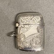 Sterling silver vesta case with chased decoration vacant cartouche by Rolason Brothers,