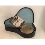 A cased Mandolin Banjo, with paperwork