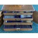 A good heavy oak cased four drawer canteen of cutlery , with brass handles , inset label to one