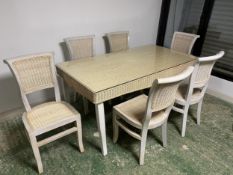 A contemporary painted wooden and wicker table with detachable glass top, and set of six chairs,