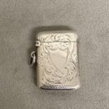 Sterling silver vesta case with chased decoration, vacant cartouche by Samuel M Levi, Birmingham
