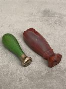 Two seals, one red hardstone and one green (possibly dyed green ivory) & silver mounted example