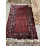 Persian, red ground Rug with multi diamond lozenge within wide multi pattern border 152cm x 94cm