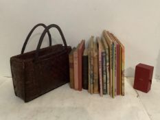 A quantity of children's vintage books, including "pop up" book, a vintage handbag and a Cartier