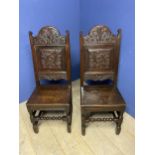 Pair of good Antique oak carved high back side chairs with solid seats with bobbin turned front