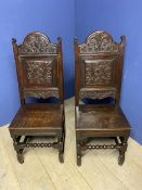 Pair of good Antique oak carved high back side chairs with solid seats with bobbin turned front