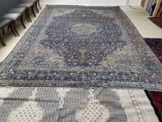 Blue Ground Rug with very fine floral pattern, surrounding a central lozenge :Vendors receipt