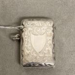 Sterling silver vesta case with chased decoration, vacant cartouche, by Samuel M Levi, Birmingham