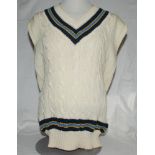India. White sleeveless Test cricket sweater with trimming in Indian colours to neck and waist.