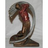 Golf. An impressive bronze metal sculpture of a golfer in full swing with the effect of the swing in