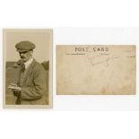 John 'Jack' White. Sepia real photograph postcard of white, half length wearing a cap, smoking a