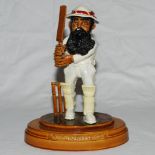 W.G. Grace. Ceramic caricature figure of Grace in cricket attire holding bat in batting pose with