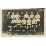 Tottenham Hotspur 1922/23. Mono real photograph postcard of the team and trainer, standing and