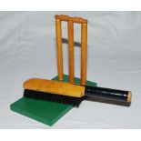Signed cricket stumps. A set of wooden decorative cricket stumps mounted on a green wooden base,