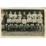 Tottenham Hotspur 1924/25. Mono real photograph postcard of the team and trainer, standing and