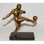 Football figure. Large and impressive bronze/spelter [?] figure of a footballer in the act of