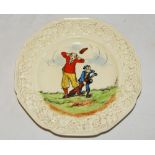 Golfing plate with humorous hand painted golfing scene. Floral and fruit decoration to rim,