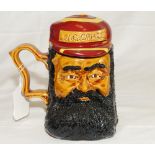 'W. G. Grace'. Ceramic caricature toby jug depicting Grace with separate lid formed as his striped