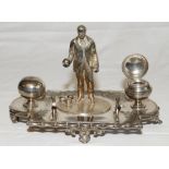 Lawn bowls. Silver metal (EPNS) ink stand of a 'bowler' standing holding a ball with three more