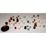 Cricket thimbles. A collection of fifty one mainly ceramic thimbles with the odd example in metal