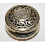 Silver pot pourri holder. Circular decorative holder with perforated top and figure of a lady